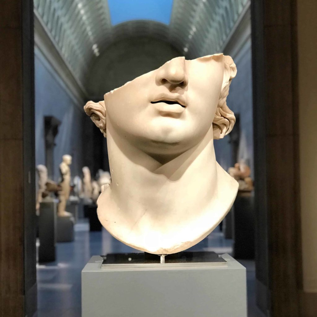 Marble sculpture of a head, broken in half