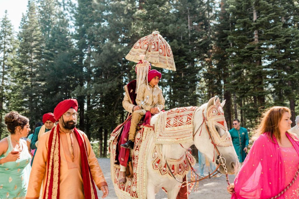 Man riding a horse for a traditional Indian Sikh wedding in Lake Tahoe