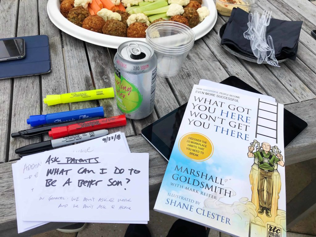 Table with markers and book and a can of sparkling water