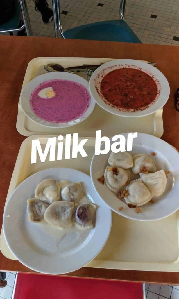 Simple food with text overlay that says “Milk bar” in Warsaw Poland