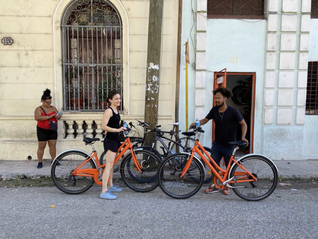 Two orange bicycles
