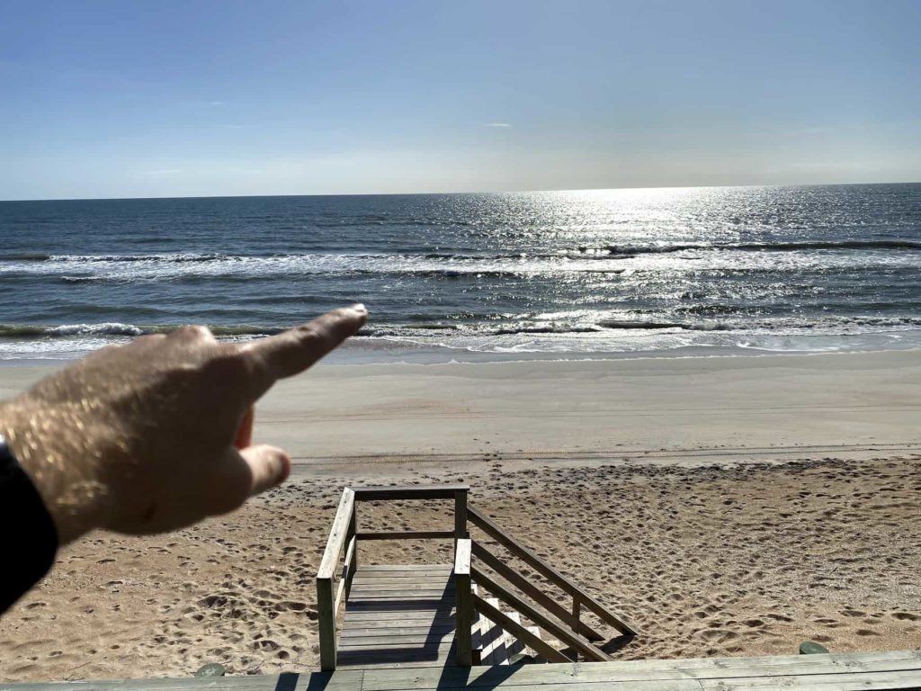 Finger pointing at St Augustine, Florida beach