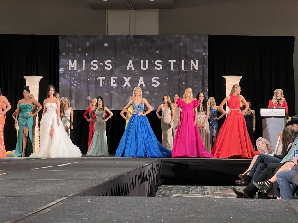 Miss Austin contestants lined up in the stage
