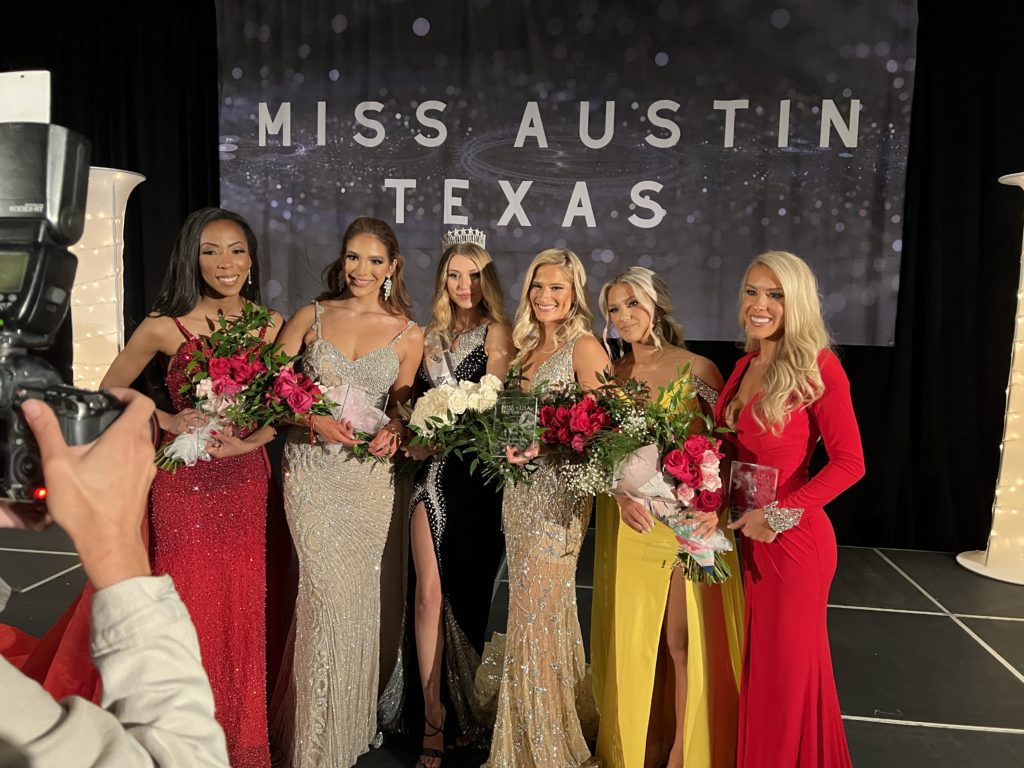 six women wearing evening gowns at a beauty pageant in Texas