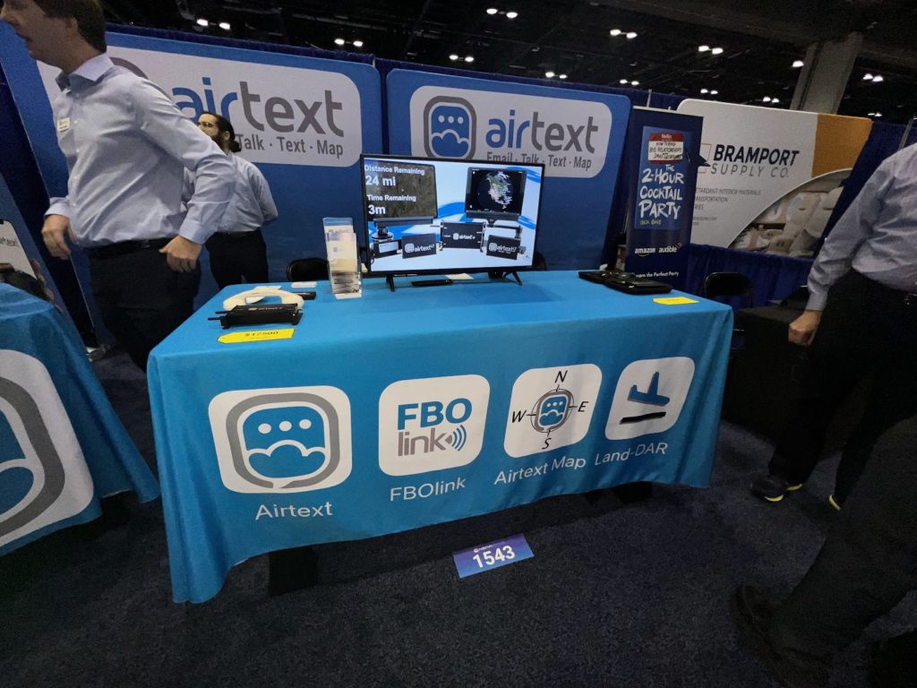 trade show table skirt showing company logo and products on display