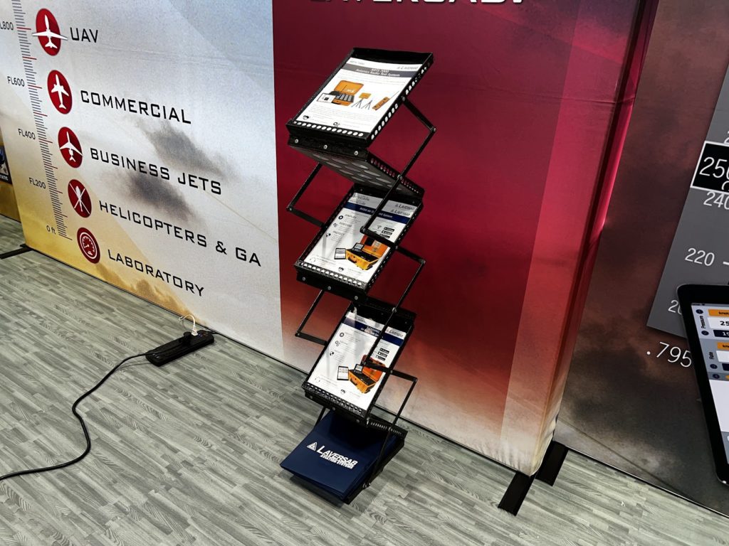 collapsible brochure stand shown at a trade show